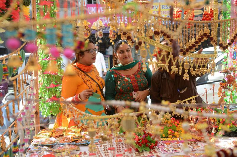 Indian shoppers look for decoration items on the eve of the Hindu festival of Diwali, in Amritsar.  AFP