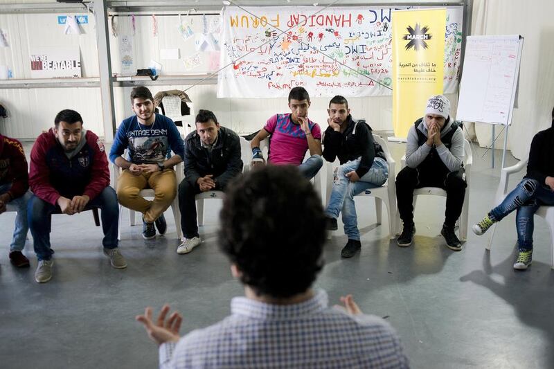 Ghassan Chahni (from left), Khaled Rustom, Samir Atris, Khider Mukhaiber, Ali Amoun, and Zulfikar Shahroon listen to director Lucien Bourjeily talk about the importance of theatre in Tripoli, Lebanon on April 24, 2015. Alex Potter for The National 