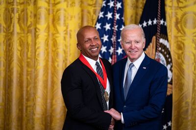 Activist Bryan Stevenson receives the National Humanities Medal from Mr Biden. Bloomberg  