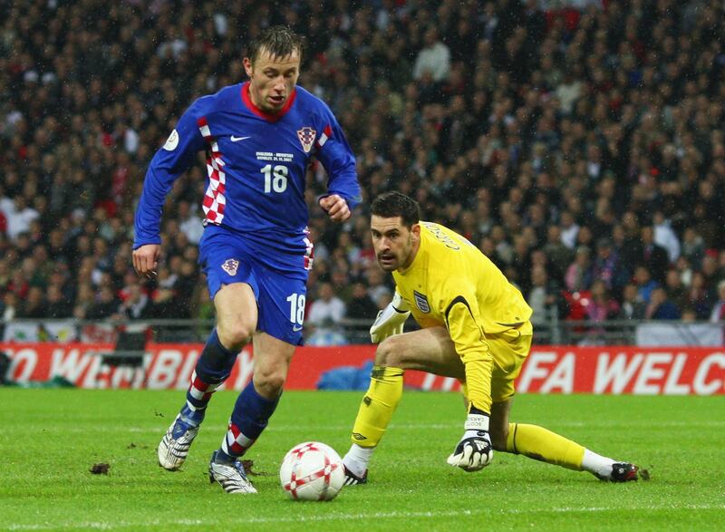 LONDON - NOVEMBER 21:  Ivica Olic of Croatia rounds Scott Carson of England for their 2nd goal during the Euro 2008 Group E qualifying match between England and Croatia at Wembley Stadium on November 21, 2007 in London, England.  (Photo by Laurence Griffiths/Getty Images)