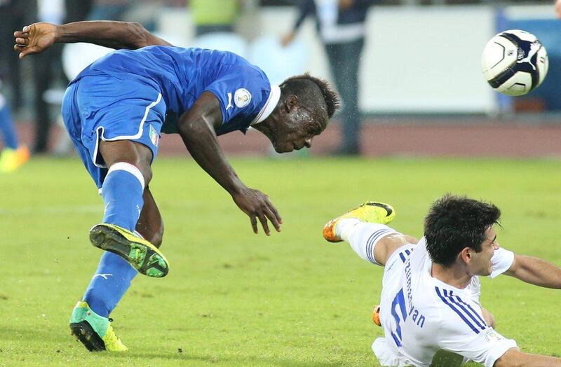 Italy 2-2 Armenia. Italy for the second match in a row needed a late goal to salvage a draw. Mario Balotelli's 76th-minute score ensured the Italians went without a loss through qualifying. Carlo Hermann / AFP