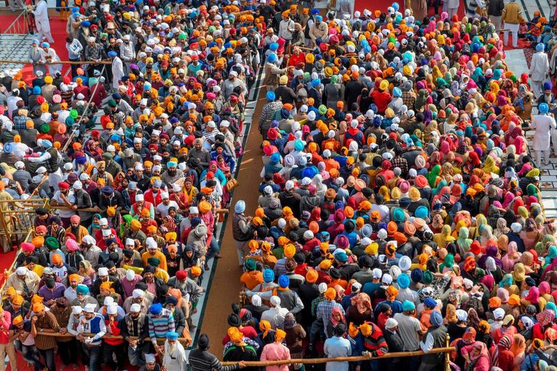 Sikh devotees pay respect on the occasion of the martyrdom day of the 9th Sikh Guru, Guru Tegh Bahadur Sahib, at the Golden Temple in Amritsar.  AFP