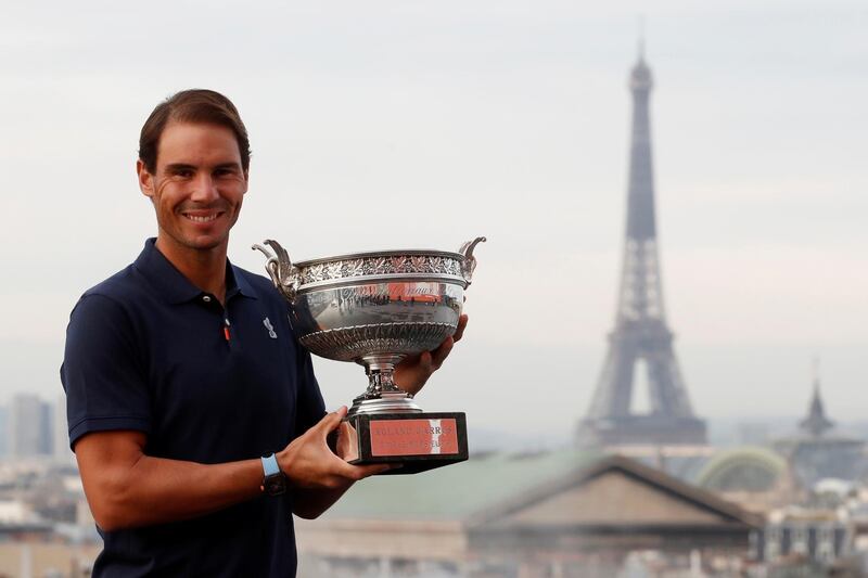 Rafael Nadal poses with the trophy after winning the French Open on Sunday. It was the Spaniard's 13th Roland Garros title. Reuters