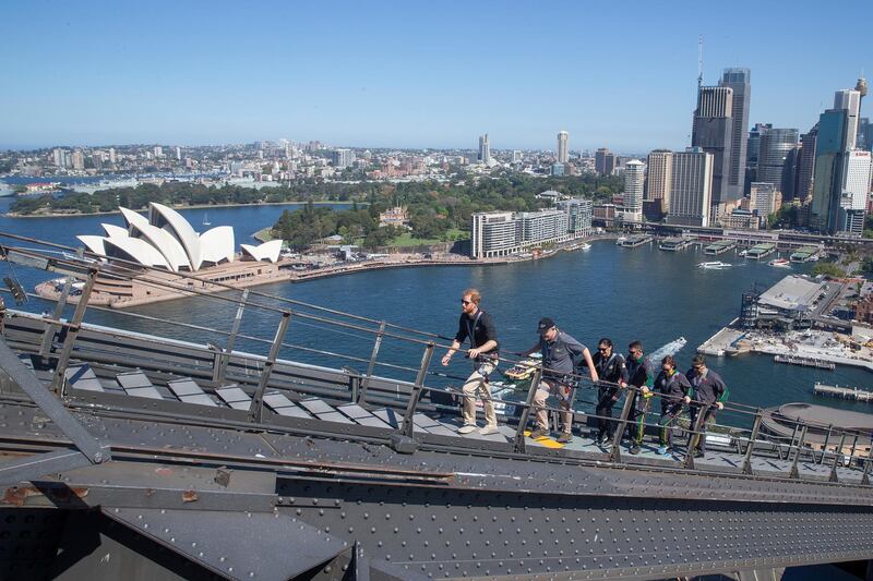 Prince Harry, Australia's Prime Minister Morrison and Invictus Games representatives climb the Sydney Harbour Bridge. AP Photo