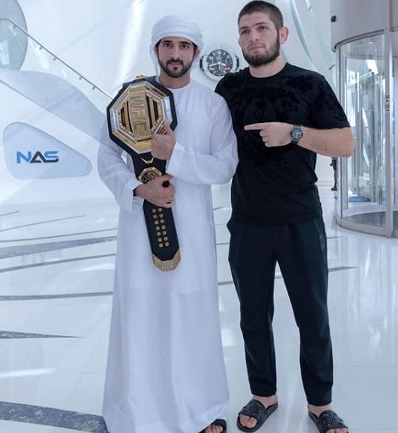 Sheikh Hamdan holds up the UFC championship belt, which Khabib Nurmagomedov won in Abu Dhabi after beating Dustin Poirier in 2019.