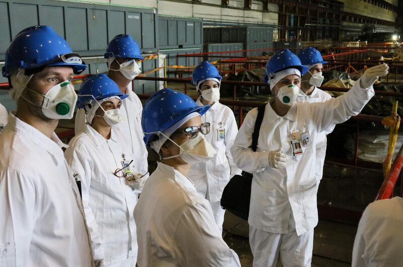 People take part in a guided tour at the inoperative Ignalina nuclear power plant.