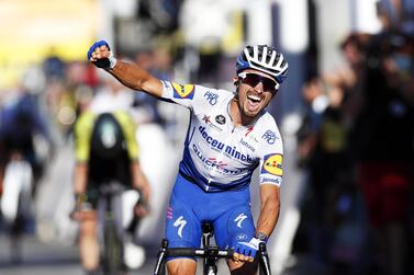 epa08635842 French rider Julian Alaphilippe of the Deceuninck Quick-Step team celebrates as he crosses the finish line to win the 2nd stage of the 107th edition of the Tour de France cycling race over 186km around Nice, France, 30 August 2020. EPA/Sebastien Nogier / Pool