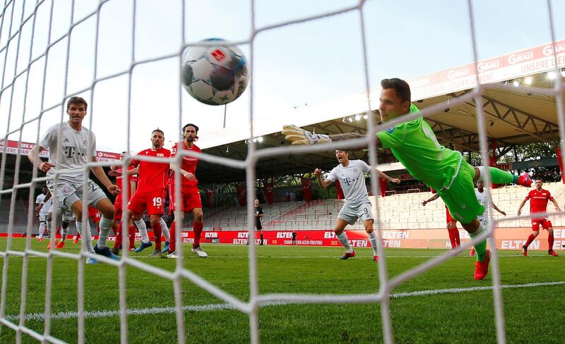 UNION BERLIN 1 BAYERN MUNICH 2. Bayern Munich's  Benjamin Pavard, hidden, scores their second goal at the Stadion An der Alten Forsterei on 17 May 2020. AFP