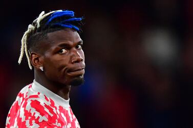 (FILES) In this file photo taken on September 29, 2021 Manchester United's French midfielder Paul Pogba warms up ahead of the UEFA Champions league group F football match between Manchester United and Villarreal at Old Trafford stadium in Manchester, north west England.  - French World Cup-winning midfielder Paul Pogba is to leave Manchester United at the end of June, the club said on June 1, 2022, bringing the curtain down on a largely disappointing second spell there.  (Photo by Anthony Devlin  /  AFP)