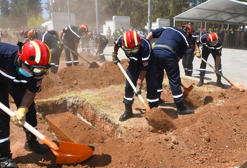 Algerian firefighters lay to rest the remains of 24 resistance fighters, returned from Paris after more than a century and a half. AFP