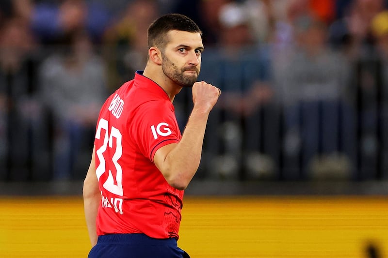 Mark Wood of England celebrates after taking the wicket of Marcus Stoinis. EPA