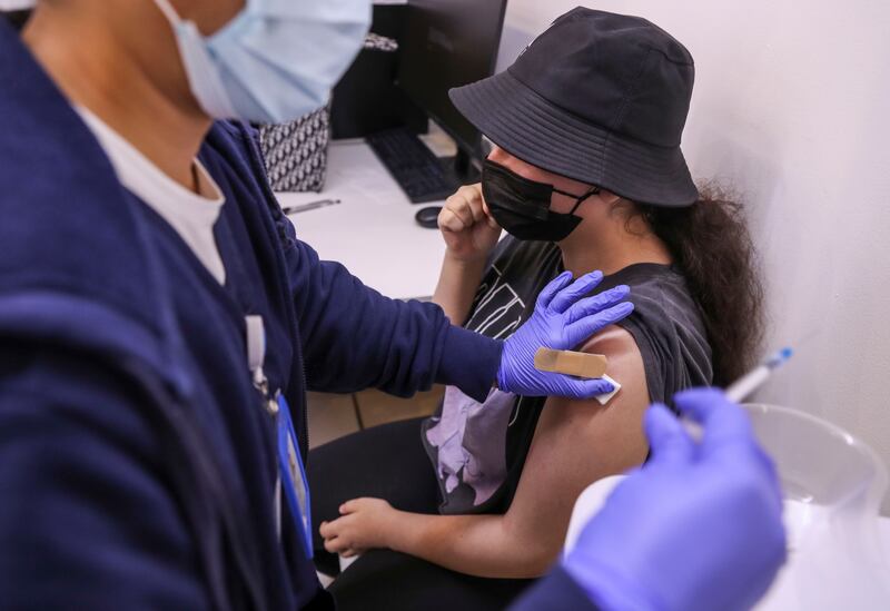 Dalaa Alaa Aladwan, 14, from Rosary School is vaccinated at Seha Vaccination Centre, Abu Dhabi Cruise Terminal, Zayed Port.