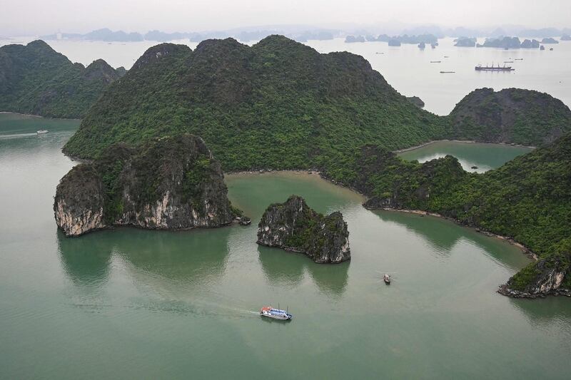 A tourist boat sails on the waters of Ha Long Bay in northeastern province of Quang Ninh, Vietnam. AFP