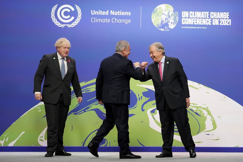 Boris Johnson greets Antonio Guterres and Palestinian Prime Minister Mohammed Shtayyeh. AP