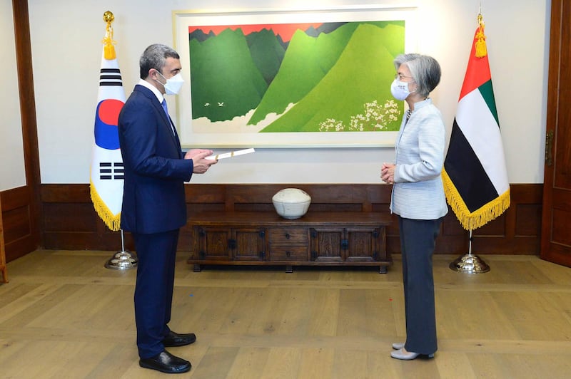 epa08538956 A handout photo made available by the South Korean Foreign Ministry shows United Arab Emirates' Foreign Minister Abdullah bin Zayed Al Nahyan (L) conveying UAE Crown Prince Mohammed bin Zayed Al Nahyan's letter to President Moon Jae-in to his South Korean counterpart, Kang Kyung-wha, during their talks at Kang's official residence in Seoul, South Korea, 10 July 2020, They discussed measures to enhance cooperation between the two countries in fighting the new coronavirus and various other fields.  EPA/SOUTH KOREAN FOREIGN MINISTRY HANDOUT SOUTH KOREA OUT HANDOUT EDITORIAL USE ONLY/NO SALES
