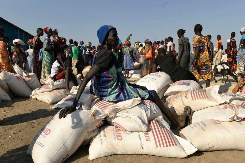 Women displaced by flooding in Bentiu, South Sudan, receive monthly food rations from the World Food Programme on February 6. AFP