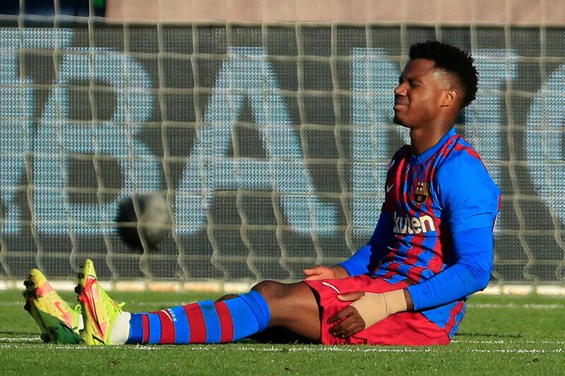 Barcelona's Ansu Fati, sits injured during the Spanish La Liga 3-3 draw at between Celta Vigo. AP