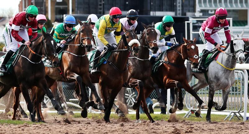 Riders compete at the Grand National. EPA