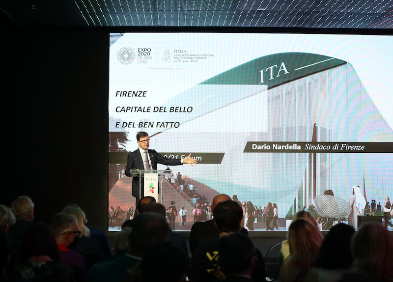 Dario Nardella, mayor of Florence, with a photo showing the facade of the Italian pavilion at Expo 2020, Dubai