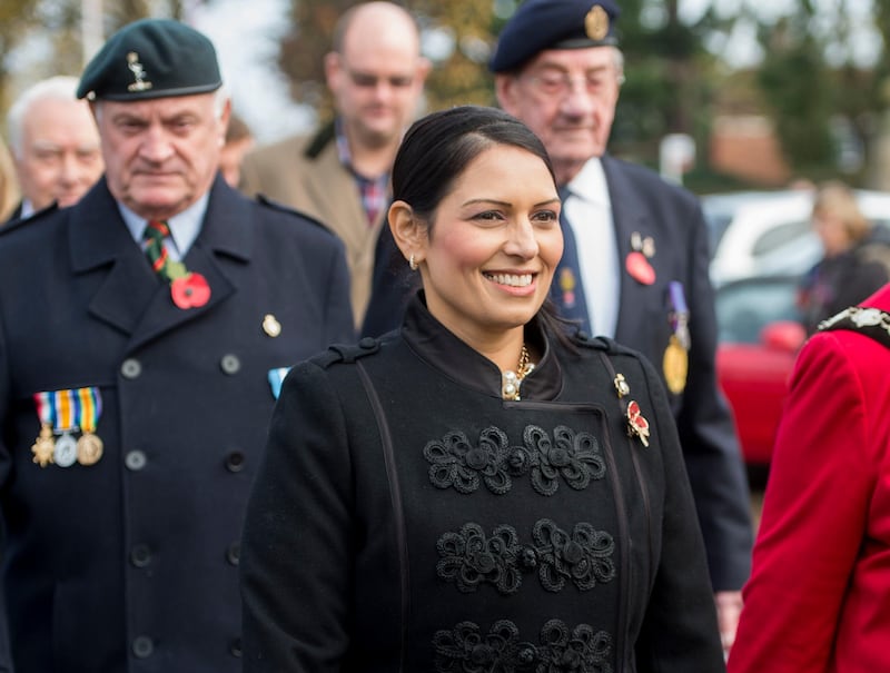 Priti Patel attends the annual service of remembrance at Witham War Memorial in Witham, east England, Saturday Nov. 11, 2017.  Priti Patel resigned from her post as Britain's international development secretary on Wednesday after revelations she had held meetings with Israeli officials, including Prime Minister Benjamin Netanyahu, without informing her colleagues or the prime minister. (David Mirzoeff/PA via AP)