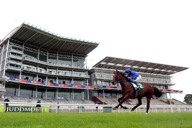 Ghaiyyath, ridden by jockey William Buick, on his way to winning the Juddmonte International Stakes at York. PA