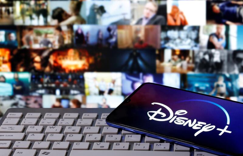FILE PHOTO: A smartphone with displayed "Disney" logo is seen on the keyboard in this illustration taken March 24, 2020. REUTERS/Dado Ruvic/File Photo