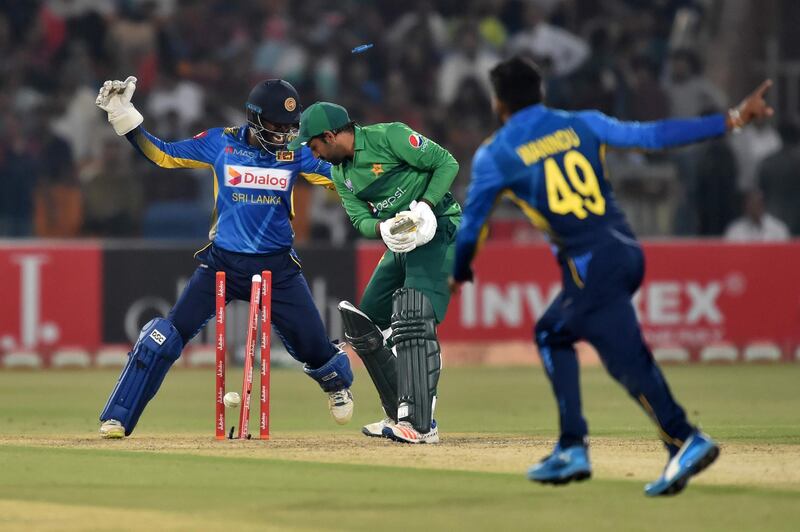 Sarfraz Ahmed was the third wicket to fall in the eighth over bowled by Hasaranga. AFP