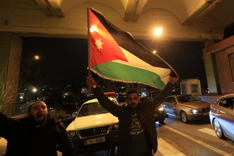 Jordanians celebrate winning the semi-final match between Jordan and South Korea, in Amman