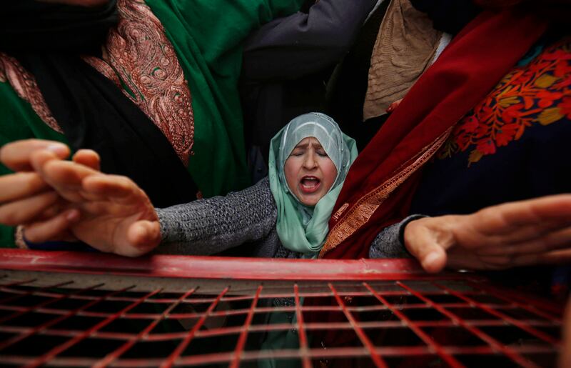 A social worker protests in Srinagar, the summer capital of Indian Kashmir, against a new human resource policy framed by the government. EPA