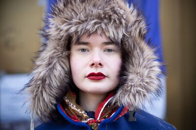 A Norwegian Sami protester poses in traditional clothes. AFP