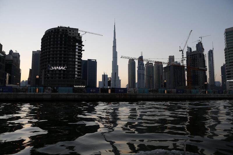 
DUBAI , UNITED ARAB EMIRATES – May 17 , 2017 : View of the Dubai Skyline from the Abra at Dubai Water Canal in Dubai. The ticket price for one trip is 25 AED per person and the total time of this ride is around 45 minutes. People can see the Burj Khalifa and other buildings from Abra during the ride. ( Pawan Singh / The National ) For News / Photo Feature. ID No :- 18945 *** Local Caption ***  PS1705- DUBAI CANAL21.jpg