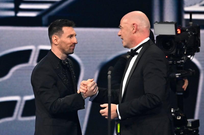 Lionel Messi shakes hands with Gianni Infantino, president of Fifa. Getty 