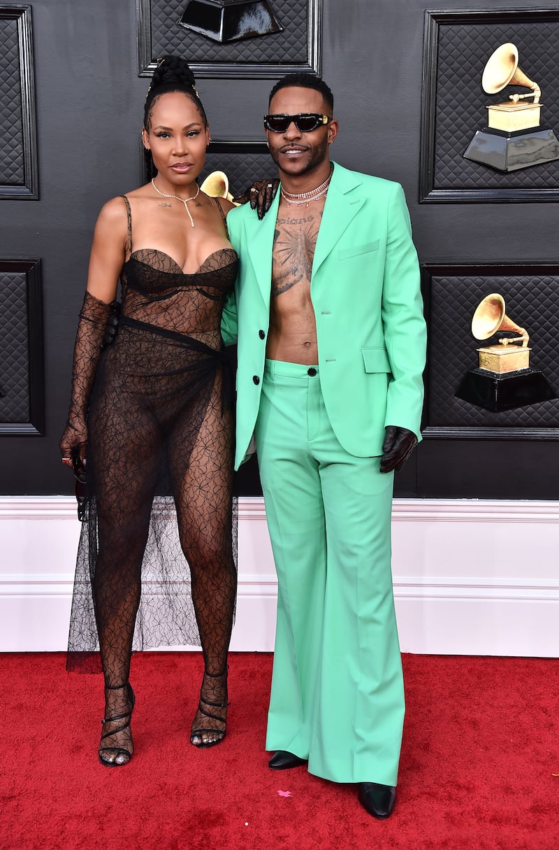 La'Myia Good and Eric Bellinger, shirtless in a turquoise suit. AP