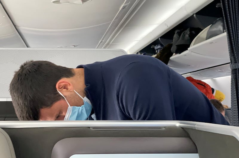 Serbian tennis player Novak Djokovic is seen after boarding a plane bound for Belgrade, after the Australian Federal Court upheld a government decision to cancel his visa to play in the Australian Open, in Dubai. Reuters