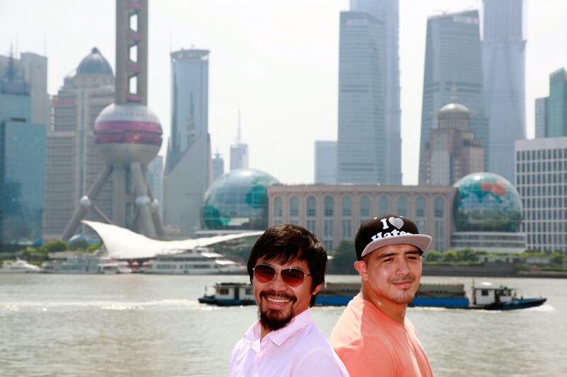 SHANGHAI, CHINA - JULY 31:  Manny Pacquiao (L) and Brandon Rios (R) pose for a picture at the Bund on July 31, 2013 in Shanghai, China.  (Photo by Kevin Lee/Getty Images) *** Local Caption ***  175066675.jpg