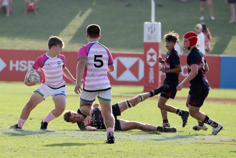 Players in action during the Gulf Under 19 boys cup semi-final 1 match between Dubai College (black) vs S22 UAE Academy  (white and pink).