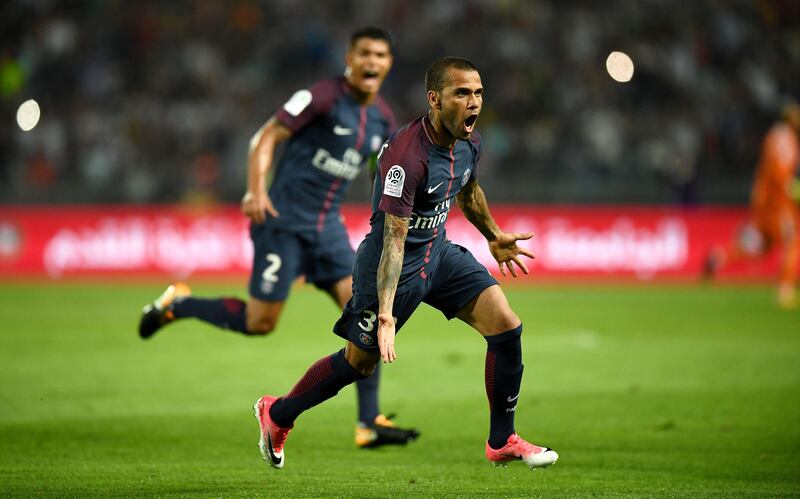Paris Saint-Germain's Brazilian defender Dani Alves celebrates after scoring a goal   during the French Trophy of Champions (Trophee des Champions) football match between Monaco (ASM) and Paris Saint-Germain (PSG) on July 29, 2017, at the Grand Stade in Tangiers. / AFP PHOTO / FRANCK FIFE
