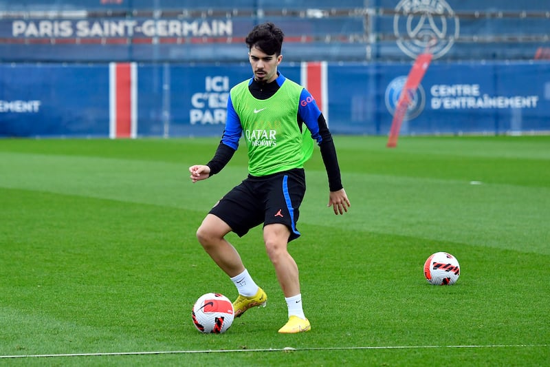 Vitinha passes the ball during a Paris Saint-Germain training session at PSG training center in Paris, France. 