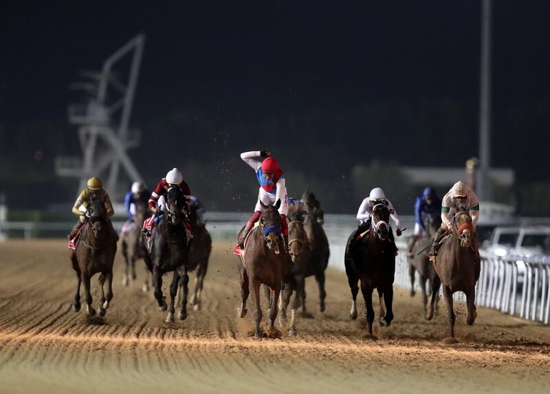 Country Grammer ridden by Frankie Dettori wins the Dubai World Cup during The Dubai World Cup at Meydan racecourse in Dubai. Chris Whiteoak / The National
