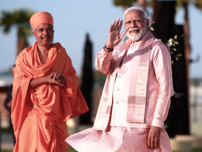 Prime Minister Narendra Modi of India arrives with Sadhu Brahmaviharidas Swami for the inauguration of the Baps Hindu Mandir in Abu Dhabi. All photos: Victor Besa / The National
