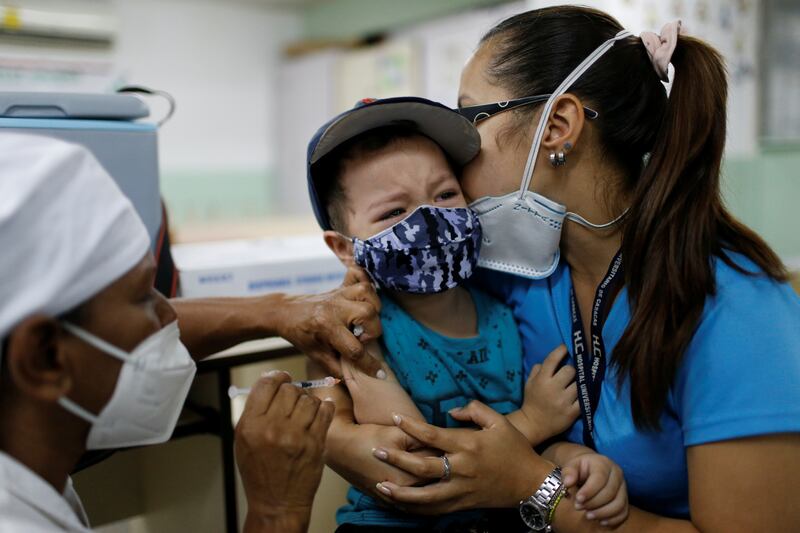 Leonardo Velasco, 4, reacts as he receives a dose of the Sinopharm vaccine in Caracas, Venezuela, Reuters