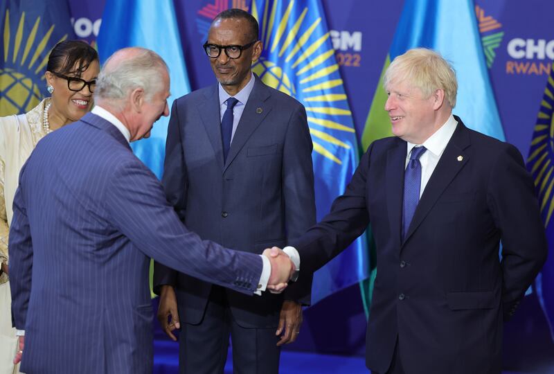 Prince Charles shakes hands with UK Prime Minister Boris Johnson at the Commonwealth Heads of Government Meeting  in Kigali, Rwanda, on June 24. PA