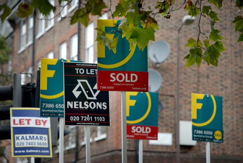 A number of signs with letting and estate agents details outside flats on the Old Kent Road in London. File Photo