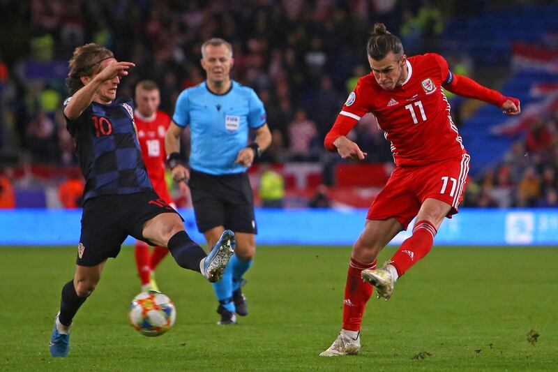 Wales' striker Gareth Bale has an unsuccessful shot under pressure from Croatia's midfielder Luka Modric. AFP