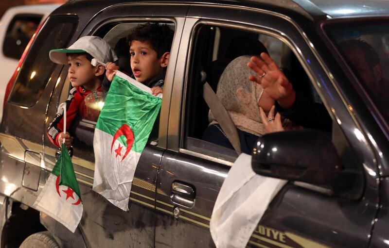 Algerian people celebrate on the streets after Mr Bouteflika submitted his resignation, in Algiers, April 2, 2019. EPA