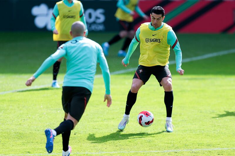 Cristiano Ronaldo works with the ball at training. EPA