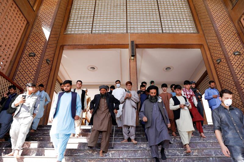 Afghans leave after prayers during Eid Al Fitr at a mosque in Kabul. REUTERS