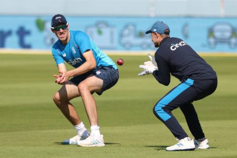 England's Craig Overton and captain Joe Root take part in a training session at Lord's cricket ground before the second Test against India.