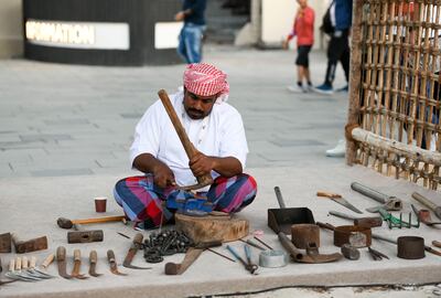 A blacksmith reenacting the old way of life in the UAE. Khushnum Bhandari / The National
