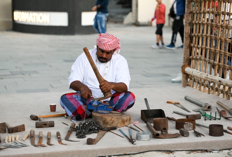 A blacksmith at work at the Sheikh Zayed Festival